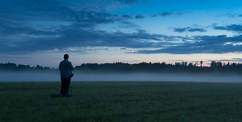 Image showing Photographer in a fog field