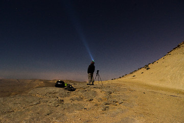 Image showing Light beam into the night desert