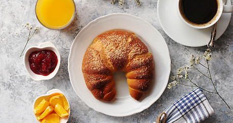 Image showing Baked croissant with drinks on table