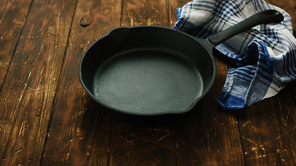 Image showing Cast iron pan on table