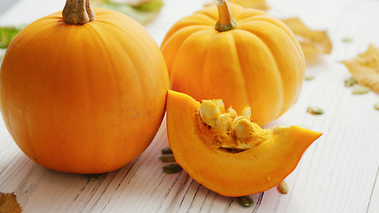 Image showing Yellow pumpkins laid on table