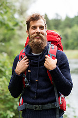 Image showing bearded traveler with backpack in woods