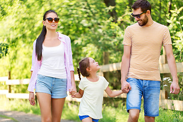 Image showing happy family walking in summer park