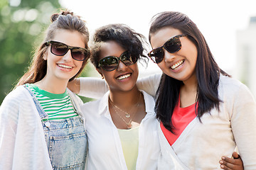 Image showing happy young women in sunglasses outdoors