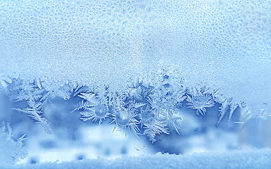Image showing Ice pattern and frozen water drops on glass