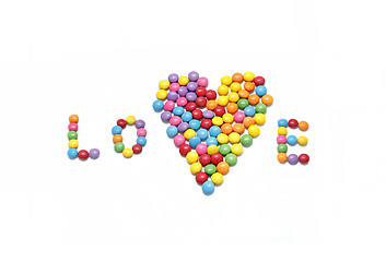 Image showing Word ''Love'' and abstract heart from bright colorful candy