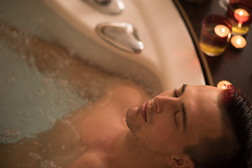 Image showing man relaxing in the jacuzzi