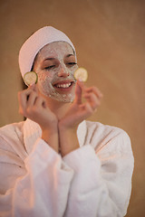 Image showing Spa Woman applying Facial Mask