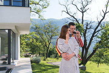 Image showing Young beautiful couple in bathrobes