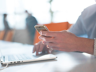 Image showing Young man holding smartphone