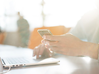 Image showing Young man holding smartphone