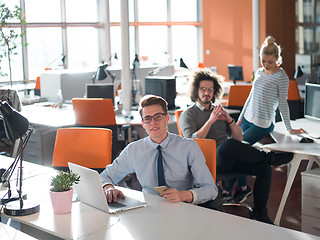 Image showing businessman working using a laptop in startup office