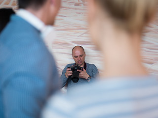 Image showing A young photographer at work