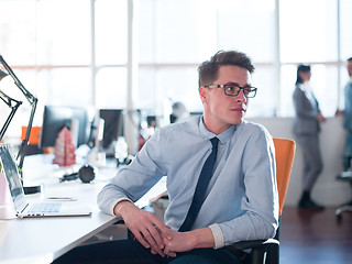 Image showing businessman working using a laptop in startup office