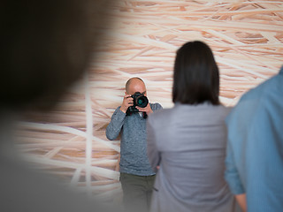 Image showing A young photographer at work