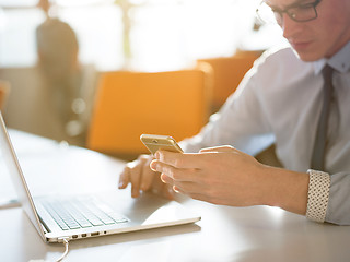 Image showing Young man holding smartphone