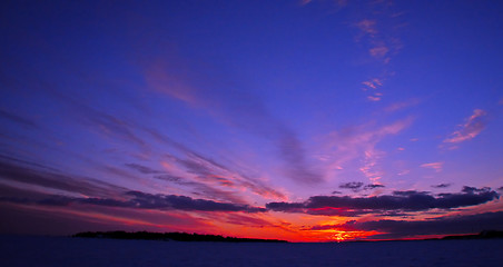 Image showing Winter sunset over frozen Baltic Sea in Finland