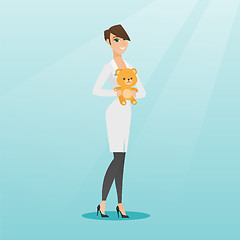 Image showing Pediatrician doctor holding teddy bear.