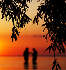 Image showing Blurred silhouette of young couple in love