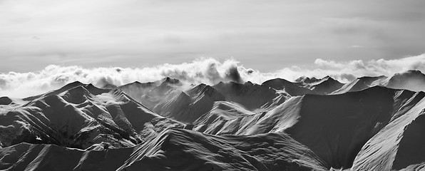 Image showing Black and white panorama of evening snow mountains