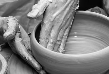 Image showing Process of making clay bowl on pottery wheel