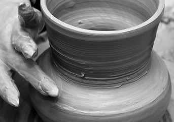 Image showing Process of making crockery on a potter\'s wheel