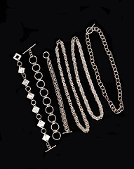 Image showing Display of silver necklace and bracelets