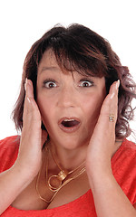Image showing Surprised woman with hands on face