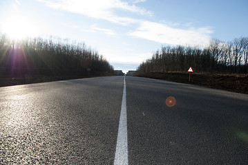 Image showing asphalt road with markings and sunlight