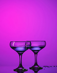 Image showing Two wine glasses standing on the table at studio