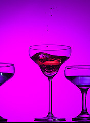 Image showing Three wine glasses standing on the table at studio