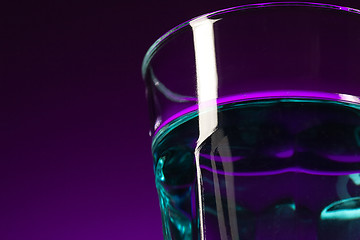 Image showing The water in glass on lilac background