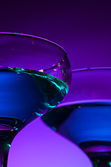 Image showing Two wine glasses standing on the table at studio