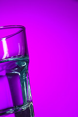 Image showing The water in glass on lilac background