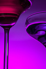 Image showing Two wine glasses standing on the table at studio