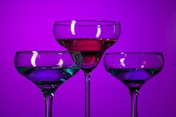 Image showing Three wine glasses standing on the table at studio