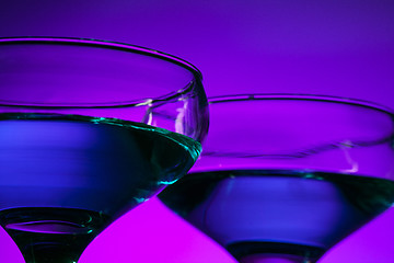 Image showing Two wine glasses standing on the table at studio