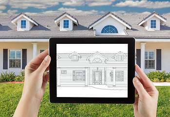 Image showing Female Hands Holding Computer Tablet with House Drawing on Scree