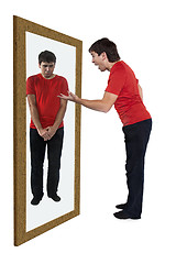 Image showing Man scolding himself in a mirror