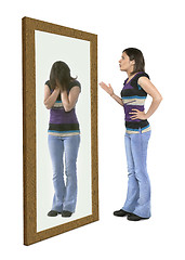 Image showing Woman scolding herself in a mirror