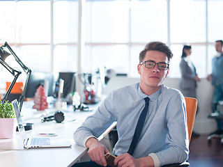 Image showing businessman working using a laptop in startup office