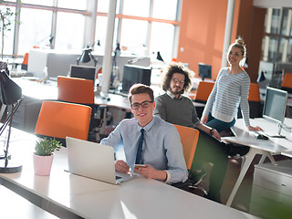 Image showing businessman working using a laptop in startup office