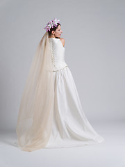 Image showing Rear view of a beautiful young woman in a wedding dress