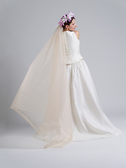 Image showing Rear view of a beautiful young woman in a wedding dress