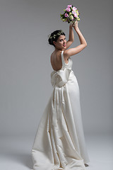 Image showing bride with a bouquet  isolated on white background