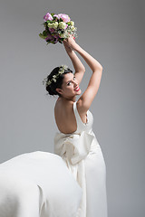 Image showing bride with a bouquet  isolated on white background