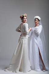 Image showing Portrait of two beautiful young bride in wedding dresses