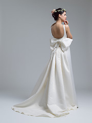 Image showing Rear view of a beautiful young woman in a wedding dress