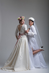 Image showing Portrait of two beautiful young bride in wedding dresses