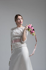 Image showing bride with a bouquet  isolated on white background